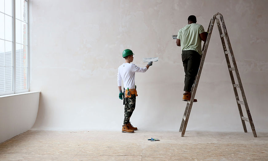 workers making plaster repairs